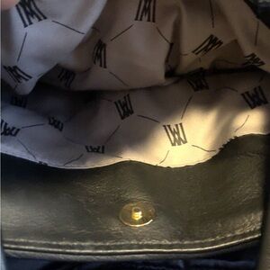 Black leather purse barley used perfect for every day use.